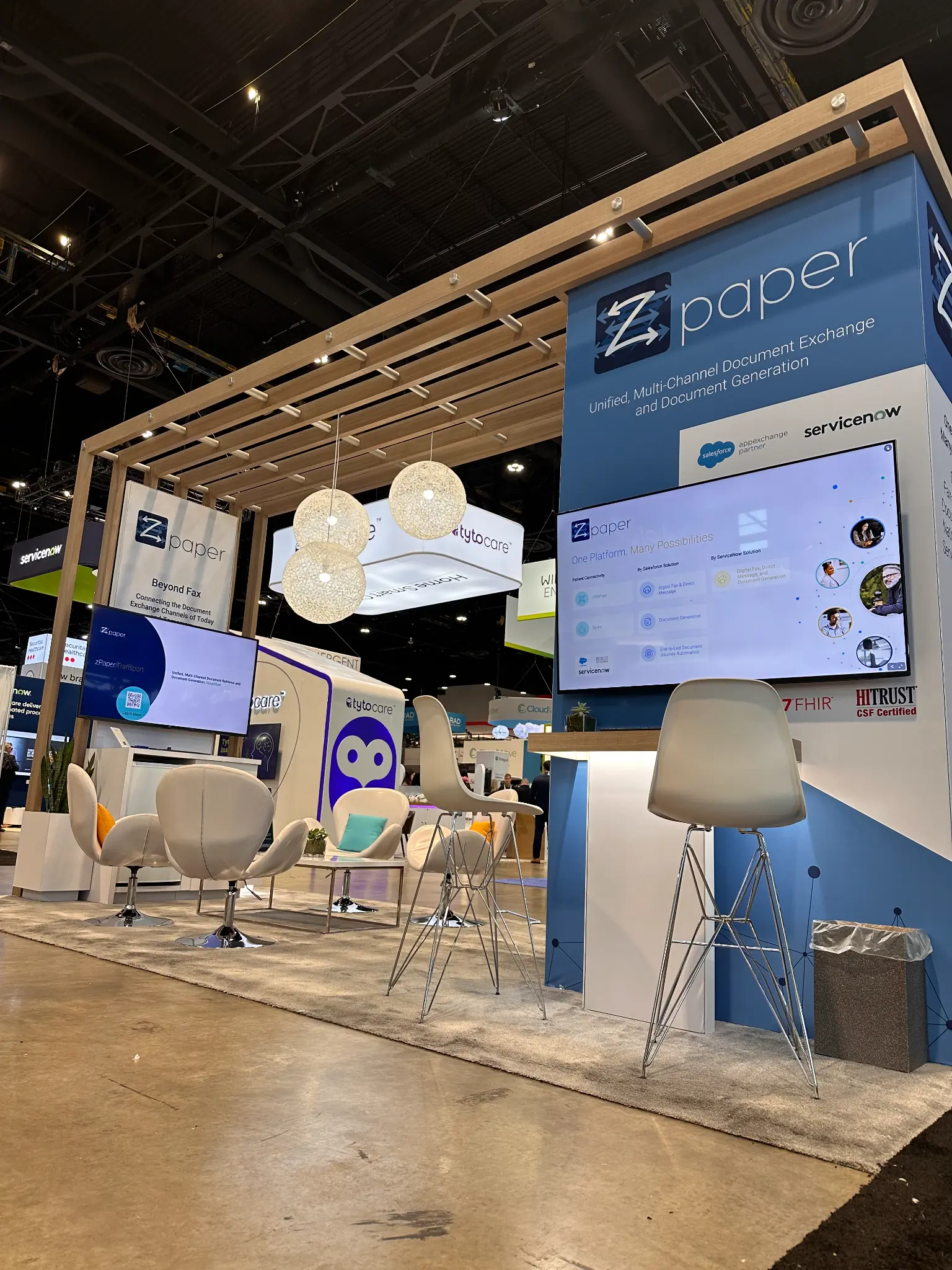 zPaper connected-document lounge with product screens at a trade show